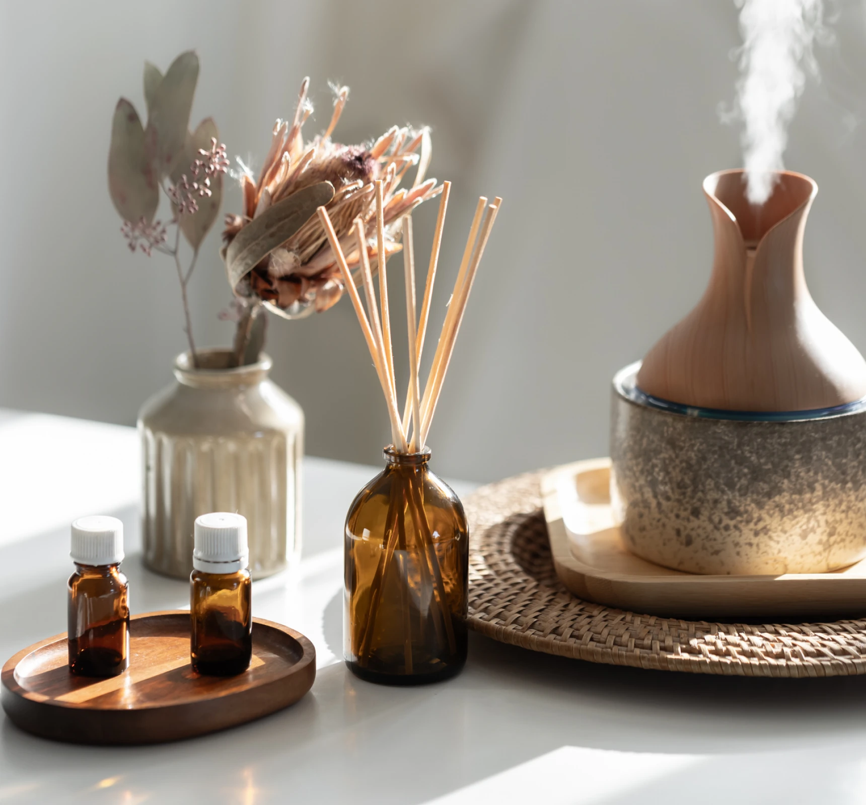 Aromatherapy setup with essential oils and diffuser